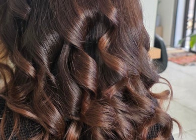 Elegant brown curls styled at The Covered Pearl, Cape Town, Western Cape, ZA.