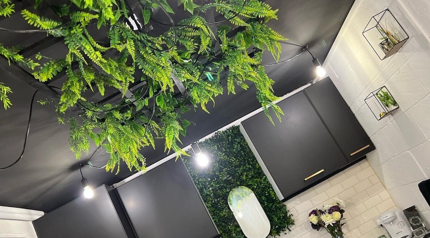 Fay Kathleen Beauty Aesthetics & Academy in Wigston, England, features a lush green ceiling decor.