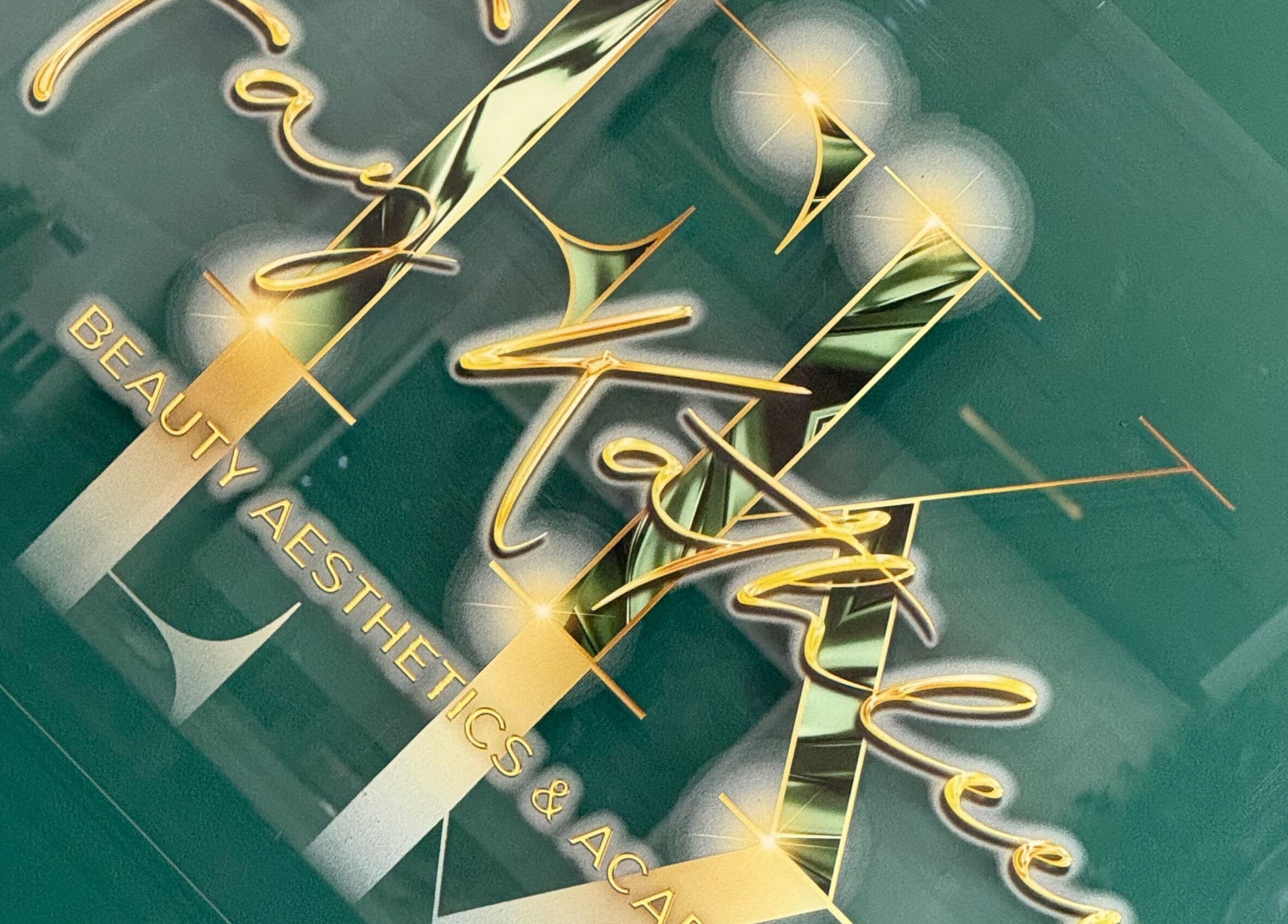 Logo of Fay Kathleen Beauty Aesthetics & Academy in Wigston, England, GB with gold lettering on a green background.