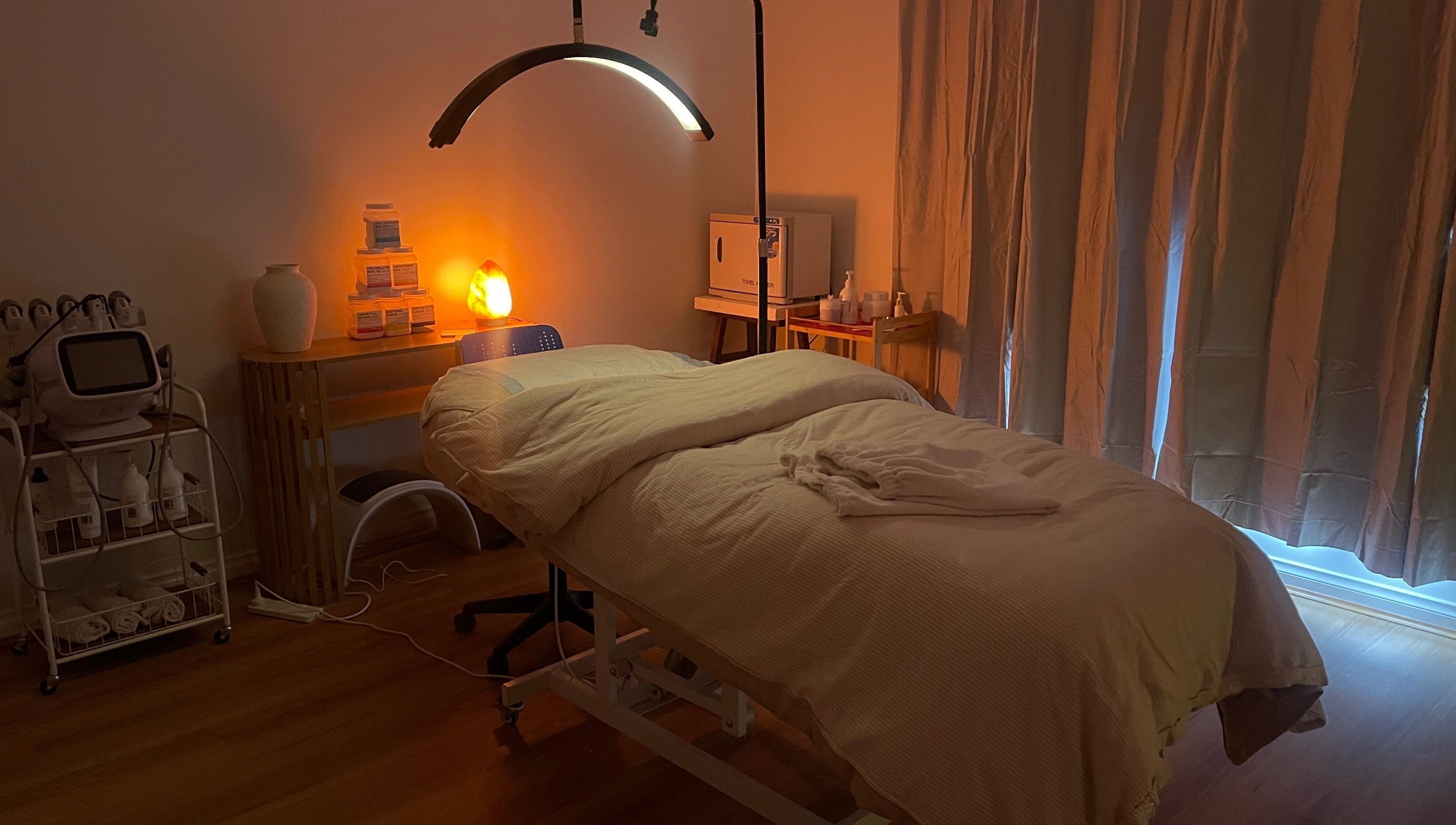 Relaxing treatment room at Love Your Skin By DK, Melbourne, Victoria, AU, featuring cozy bedding and soft lighting.