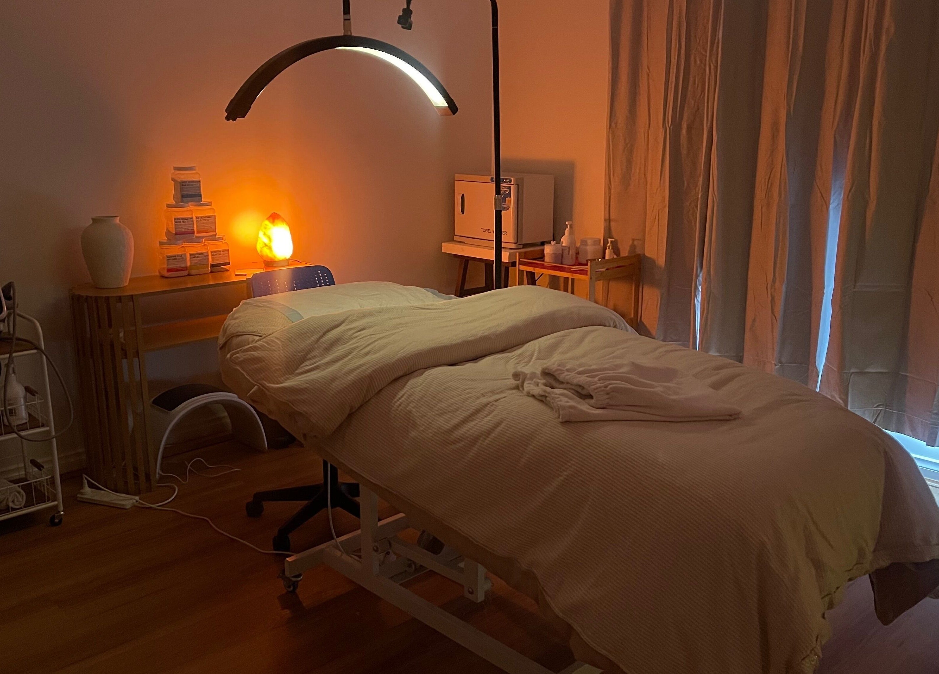 Relaxing treatment room at Love Your Skin By DK, Melbourne, Victoria, AU, featuring cozy bedding and soft lighting.