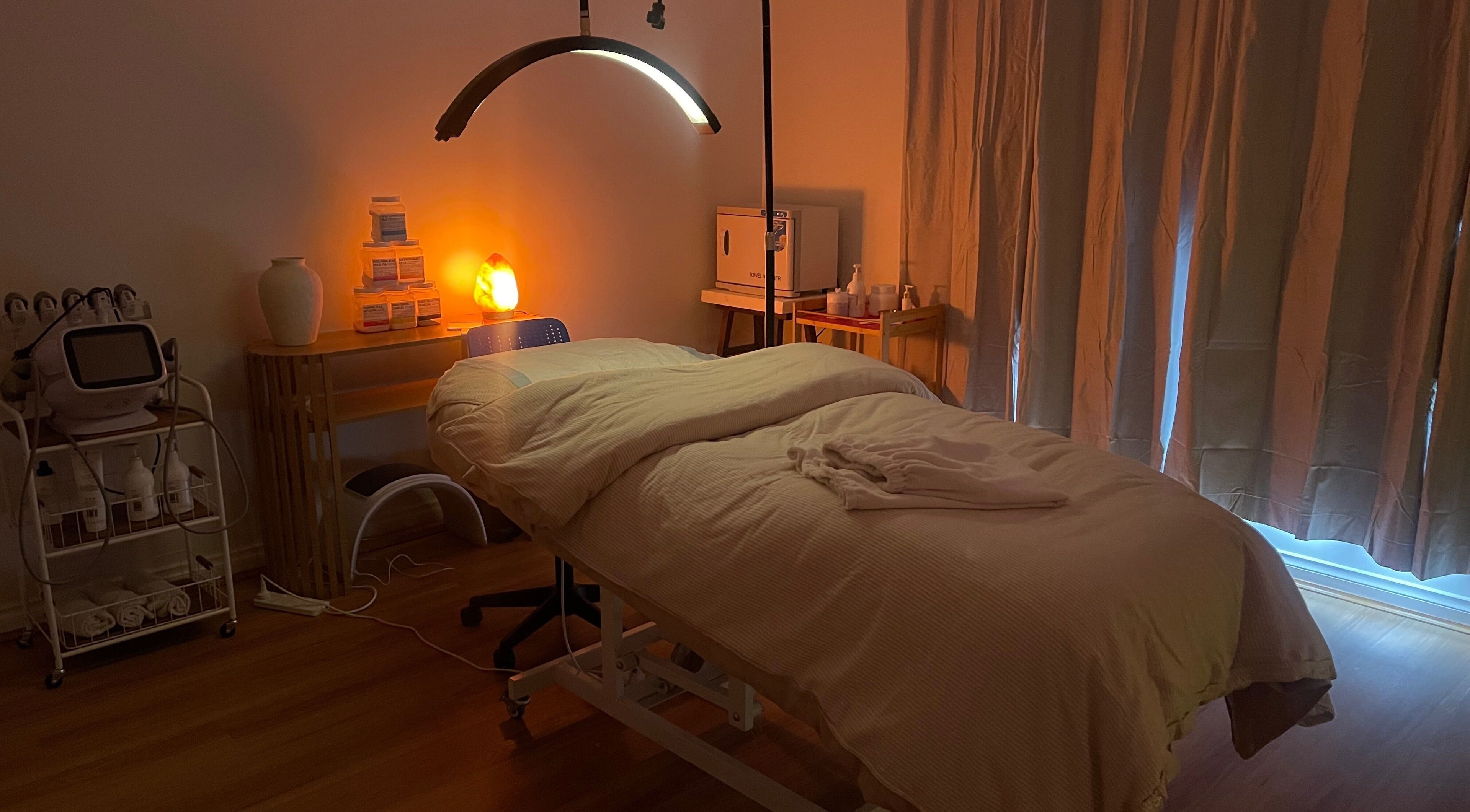 Relaxing treatment room at Love Your Skin By DK, Melbourne, Victoria, AU, featuring cozy bedding and soft lighting.