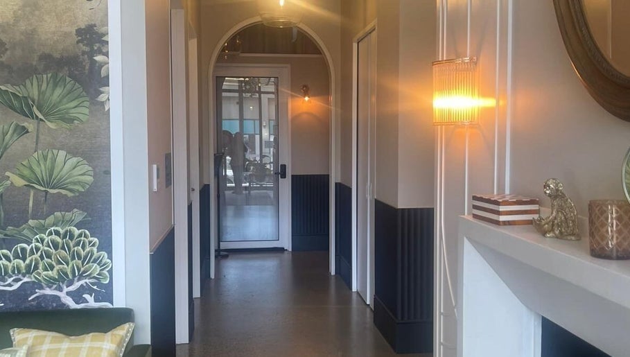 Elegant hallway with warm lighting at Love Your Skin by DK - Moonee Ponds, Melbourne, Victoria, AU.