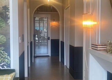 Elegant hallway with warm lighting at Love Your Skin by DK - Moonee Ponds, Melbourne, Victoria, AU.
