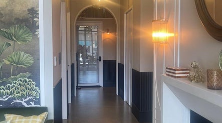 Elegant hallway with warm lighting at Love Your Skin by DK - Moonee Ponds, Melbourne, Victoria, AU.