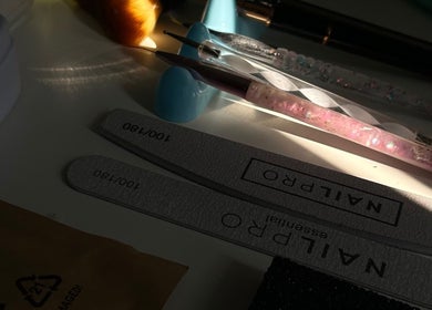 Nail tools and files at Mani by Jay, London, England, GB, basked in soft light.