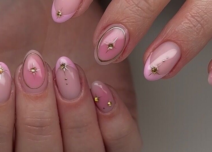 Elegant pink floral nail art from Mani by Jay in London, England, GB captures sophisticated beauty.