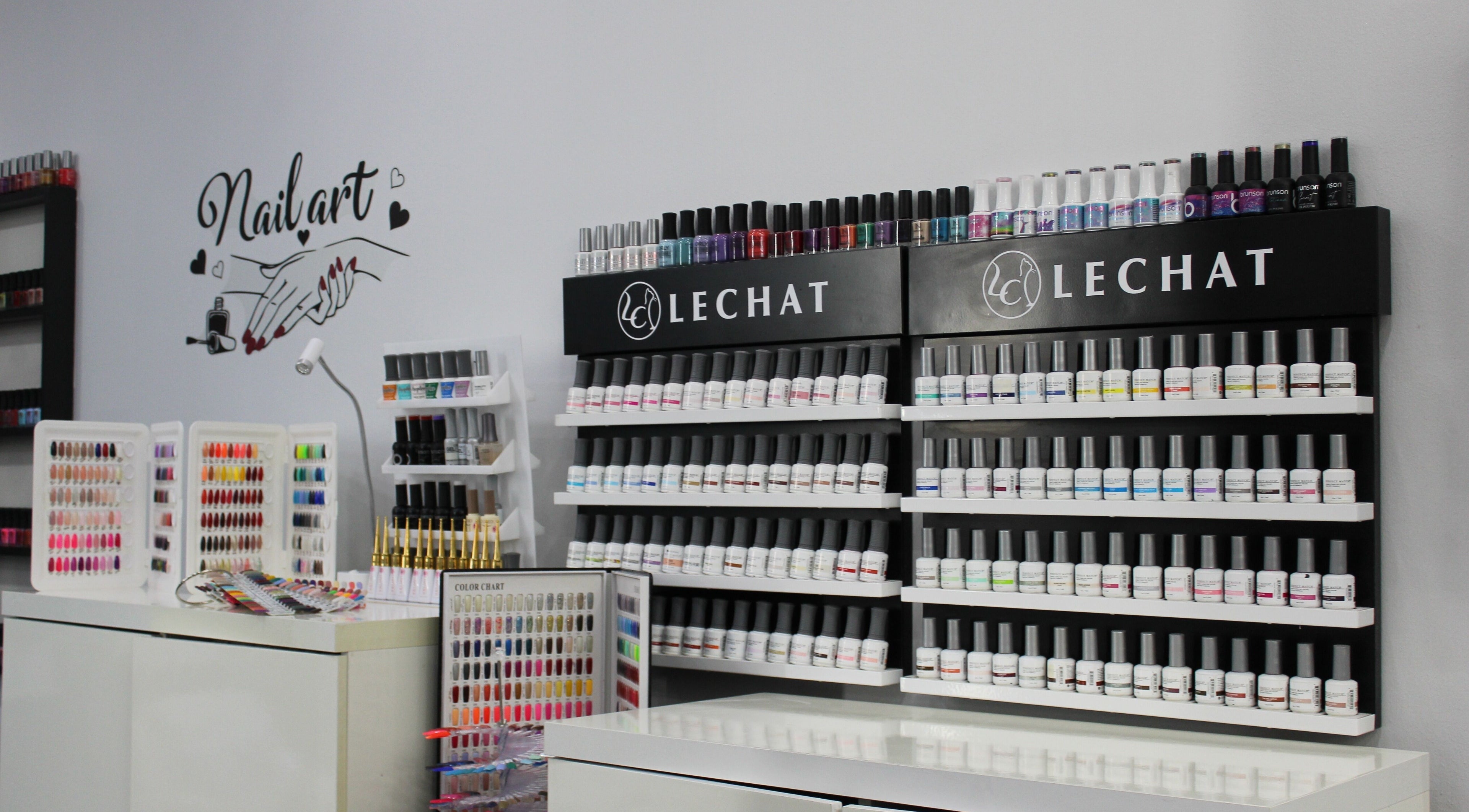 Nail polish collection at Nail Candy, Dubai, Dubai, AE showcases diverse shades and styles.