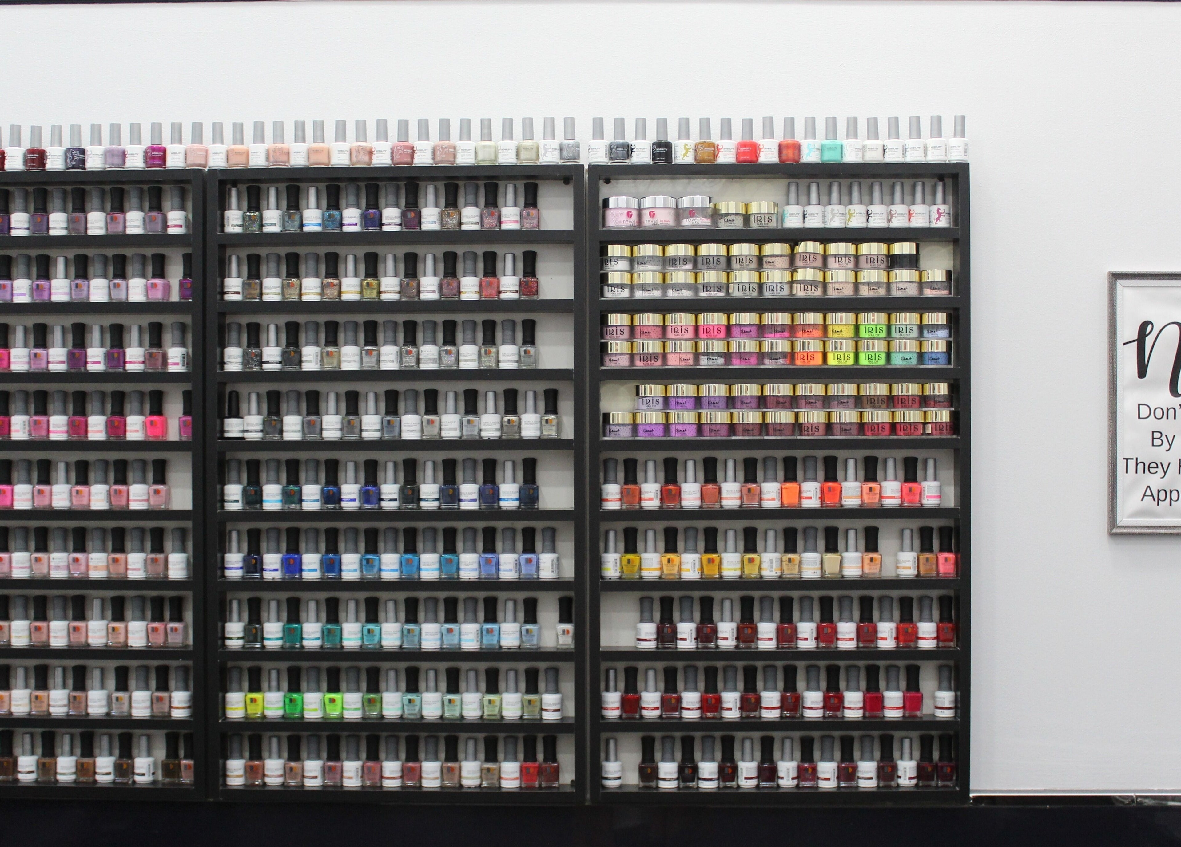Vibrant nail polish display at Nail Candy in Dubai, Dubai, AE, showcasing a wide range of colors.