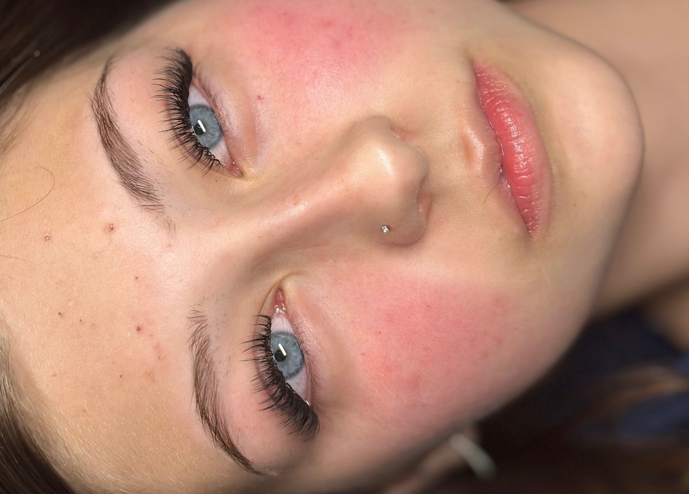 Close-up of a woman's face highlighting glowing skin at Callan J Artistry, Cape Town, Western Cape, ZA.