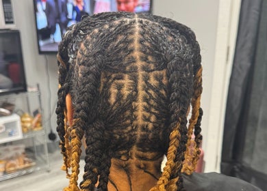 Intricate braided hairstyle created at Naturally D’ Fine Beauty, Greensboro, North Carolina, US salon.