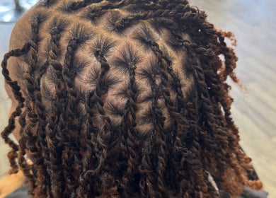 Detailed hair braiding at Naturally D’ Fine Beauty in Greensboro, North Carolina, US.