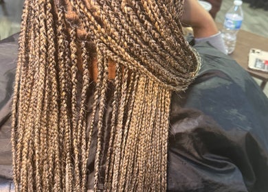 Detailed view of intricate braids at Naturally D’ Fine Beauty, Greensboro, North Carolina, US.