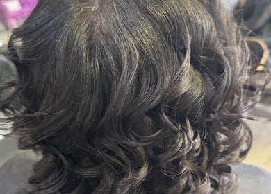 Luxurious black curls styled at Naturally D’ Fine Beauty in Greensboro, North Carolina, US salon.
