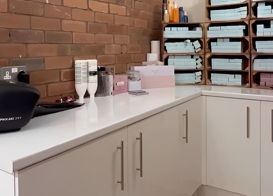 Organized beauty workspace at Omor Studio in Wetherby, England, GB showcasing shelves and supplies.