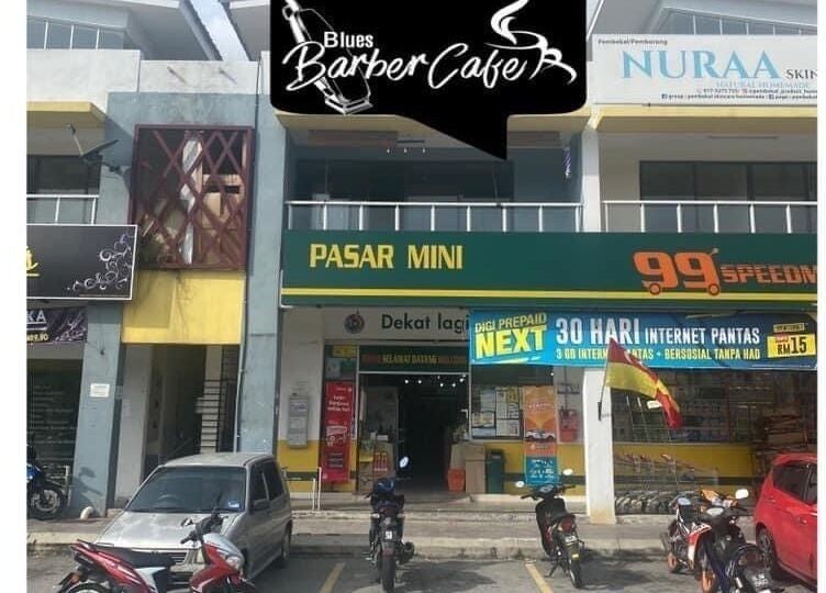Front view of Blues Barbershop, located at Sungai Buloh, Selangor, MY, beside convenience stores.