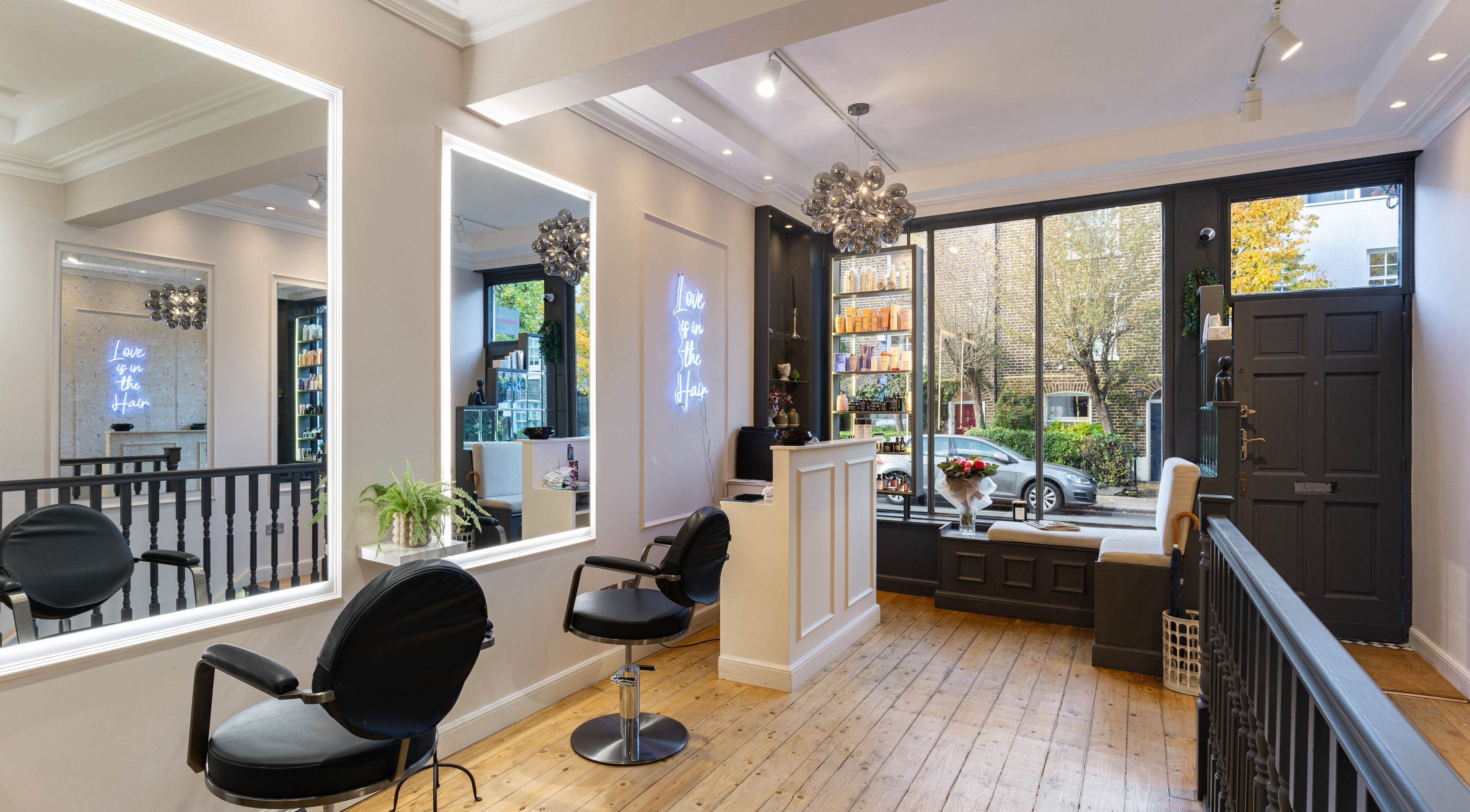 Modern interior of Giovanni Messina Hair and Beauty, London, England, GB, featuring stylish salon chairs and decor.