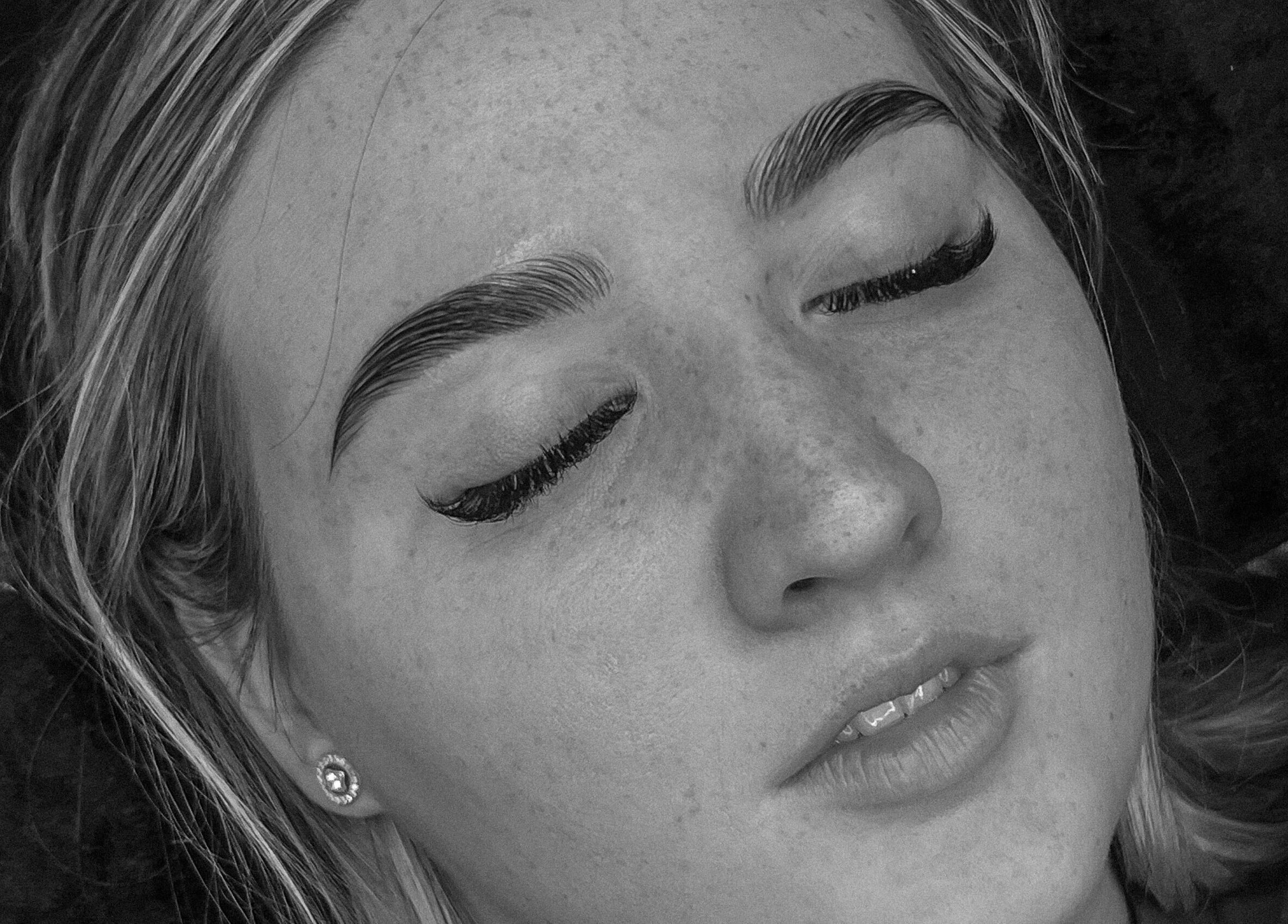 Close-up of a woman's serene face post-treatment at Zoe Louise Beauty Bar, Toowoomba City, Queensland, AU.