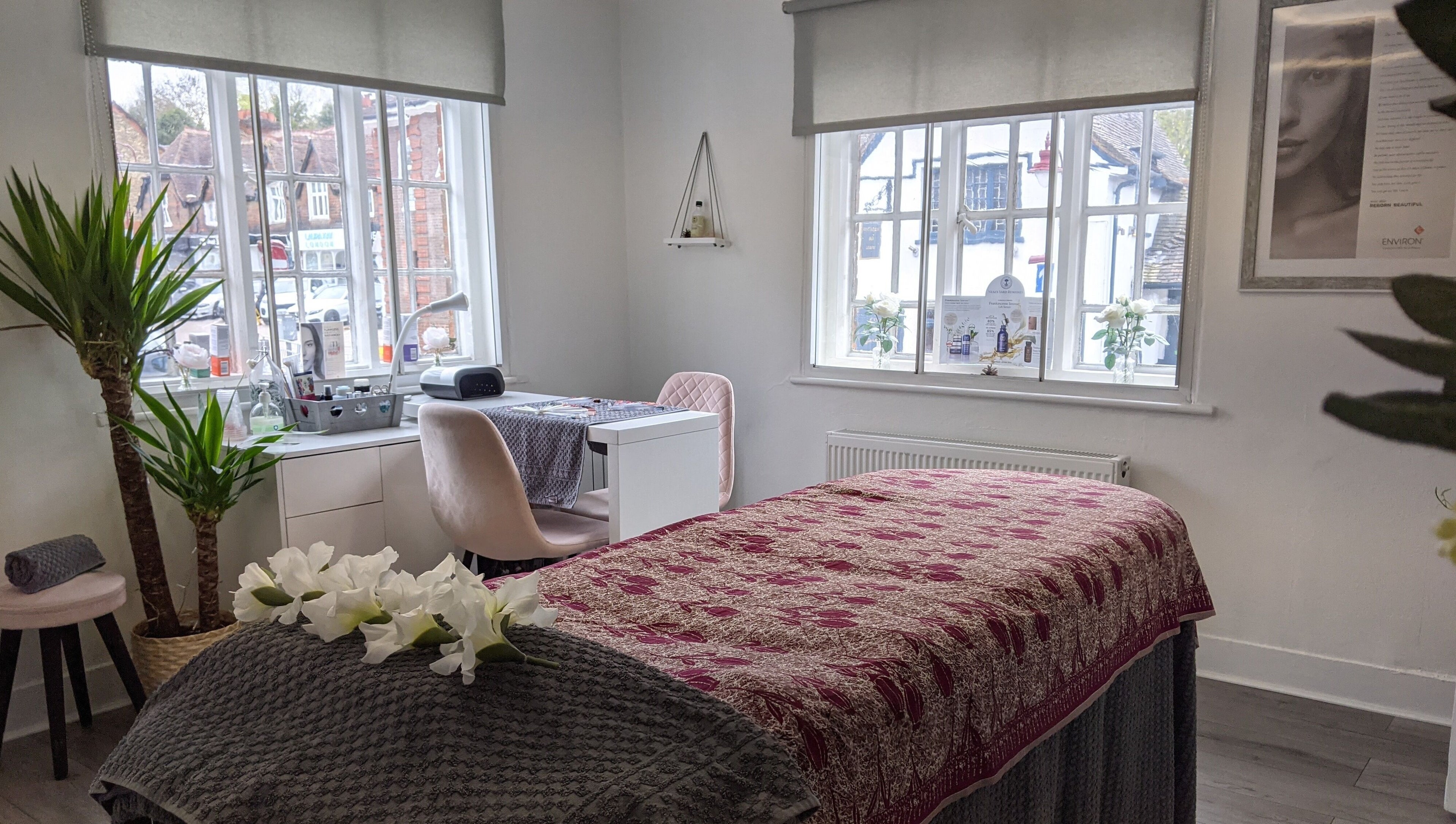 Serene treatment room at Beauty in the Woods, Radlett, England, GB with cozy decor and warm natural light.