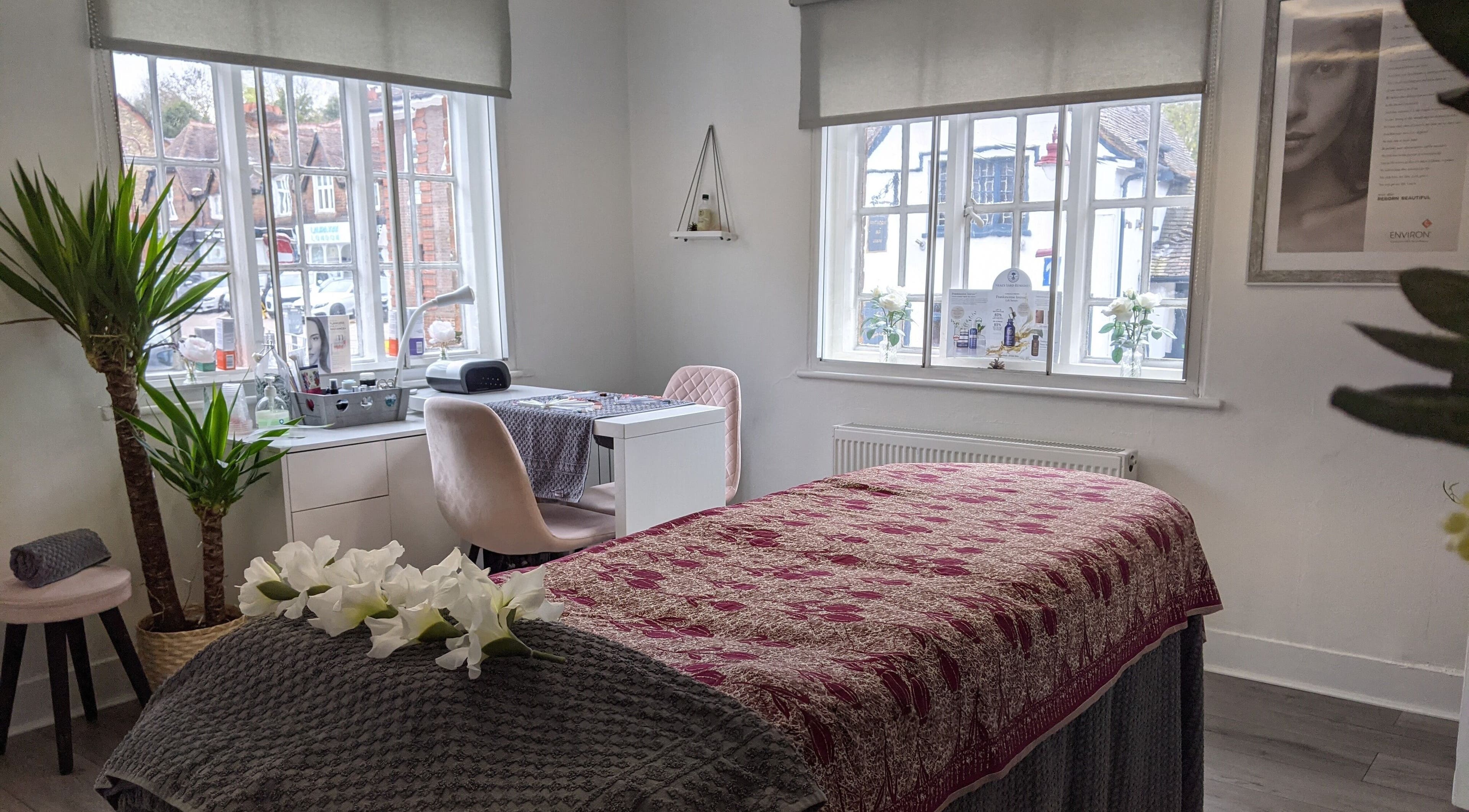 Serene treatment room at Beauty in the Woods, Radlett, England, GB with cozy decor and warm natural light.