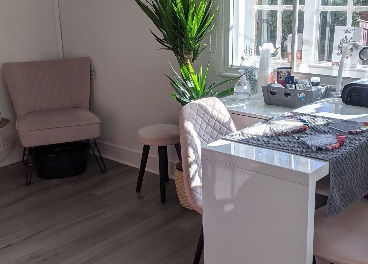 Cozy beauty station at Beauty in the Woods, Radlett, England, GB, with plush seating and serene decor.