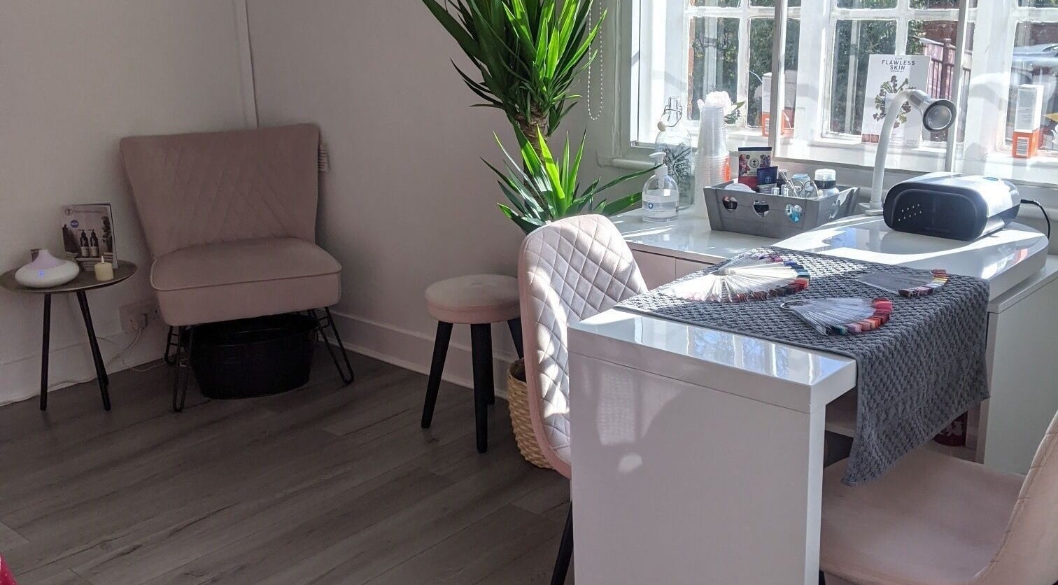 Cozy beauty station at Beauty in the Woods, Radlett, England, GB, with plush seating and serene decor.