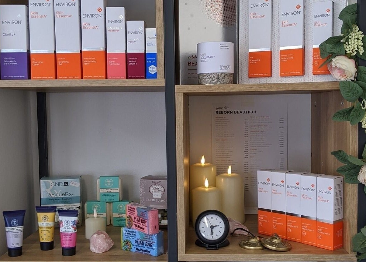 Beauty in the Woods in Radlett, England, showcases skincare products beautifully arranged on wooden shelves.