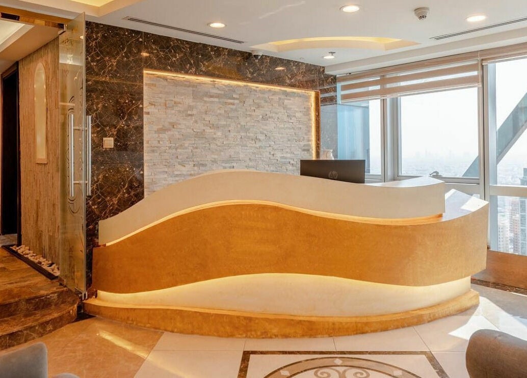 Luxurious reception area at Effect Spa, Dubai, Dubai, AE, featuring sleek design and city views.