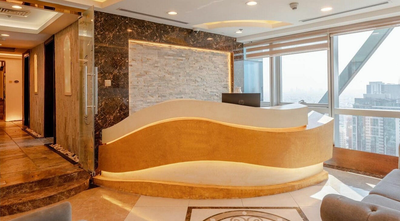 Luxurious reception area at Effect Spa, Dubai, Dubai, AE, featuring sleek design and city views.
