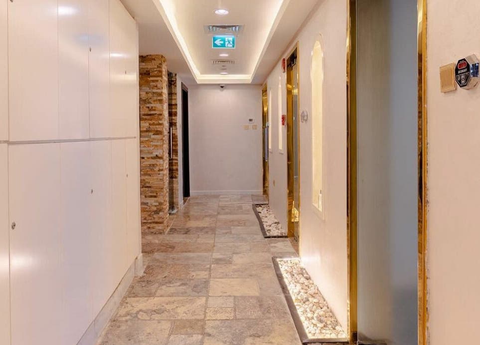 Elegant corridor at Effect Spa, Dubai, Dubai, AE with soft lighting and modern decor