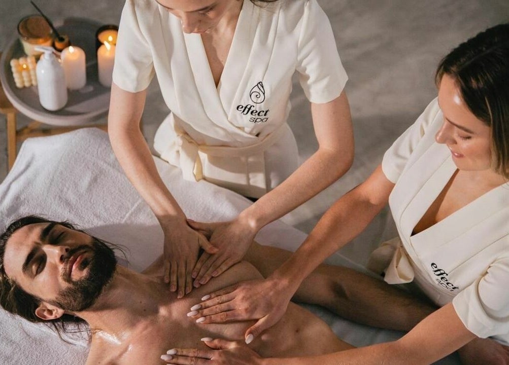 Relaxing massage at Effect Spa in Dubai, Dubai, AE performed by two therapists on a comfortable table.