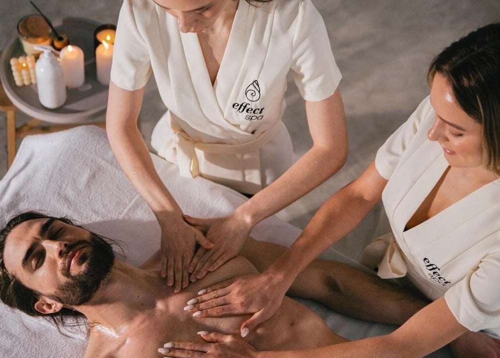 Two therapists performing a relaxing massage at Effect Spa, Dubai, Dubai, AE, enhancing wellness.