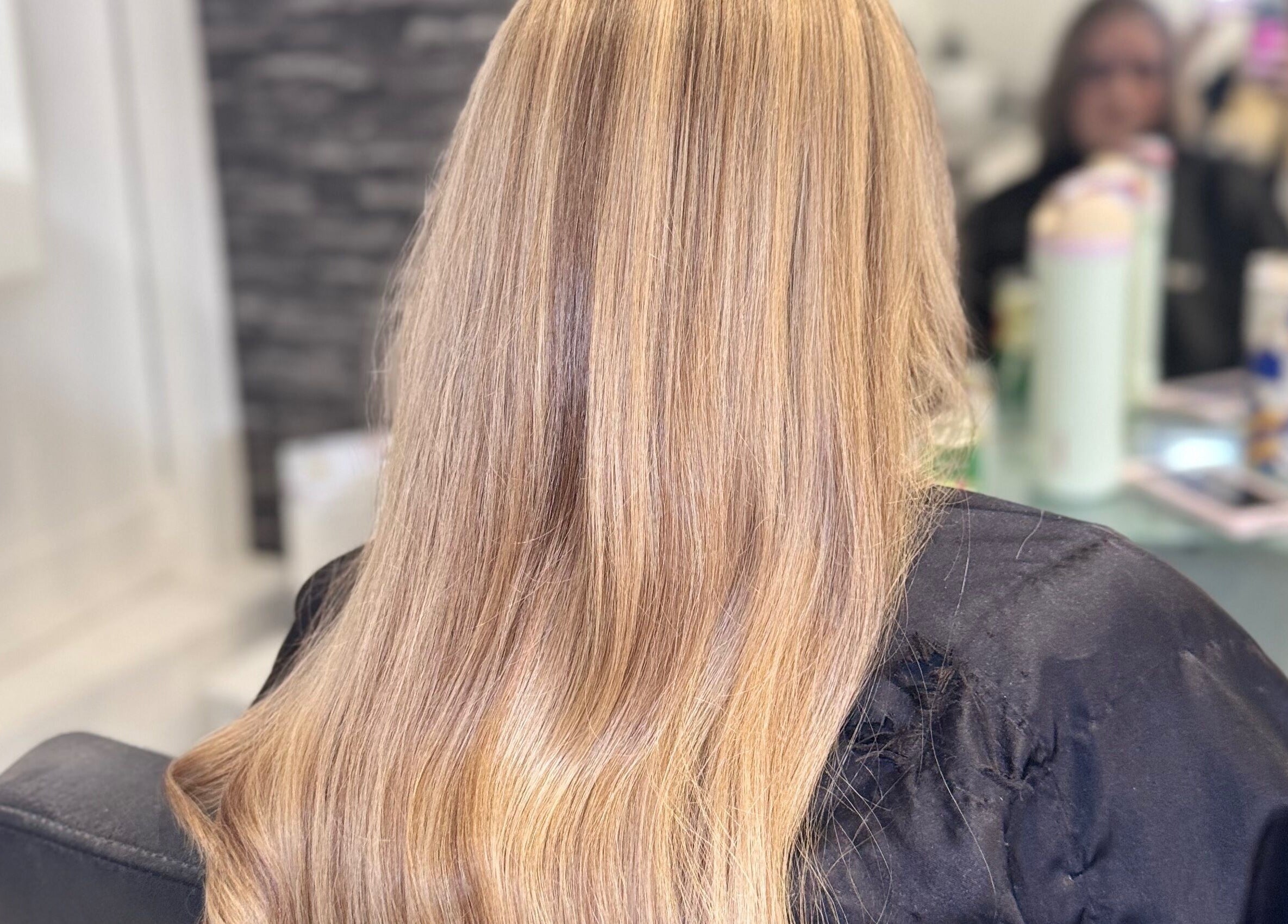 Long blonde hair beautifully styled at Hair and Aesthetics by Sophie, Marlow, England, GB.