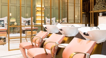 Luxurious interior of Lunatic Fringe Ladies Salon, Dubai, Dubai, AE, showcasing plush pink seating and wash stations.