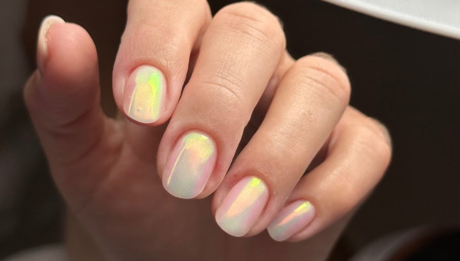 Shimmering nail art at iloNails.tech in Worcester, England, GB showcasing rainbow hues.