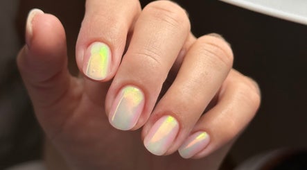 Shimmering nail art at iloNails.tech in Worcester, England, GB showcasing rainbow hues.