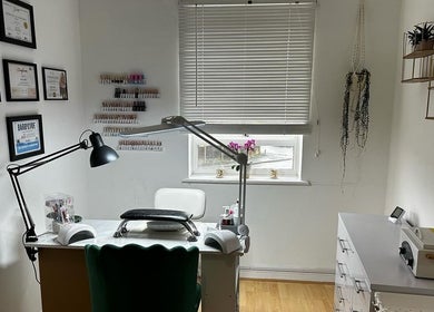 Modern nail service desk at Ilo Nails.Tech, Worcester, England, GB with certificates and stylish decor.