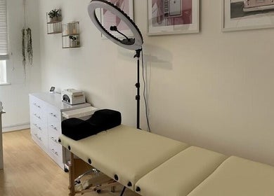 Relaxing treatment room at iloNails.tech, Worcester, England, GB with a massage bed and beauty tools.