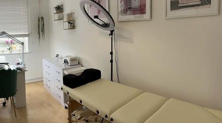 Relaxing treatment room at iloNails.tech, Worcester, England, GB with a massage bed and beauty tools.