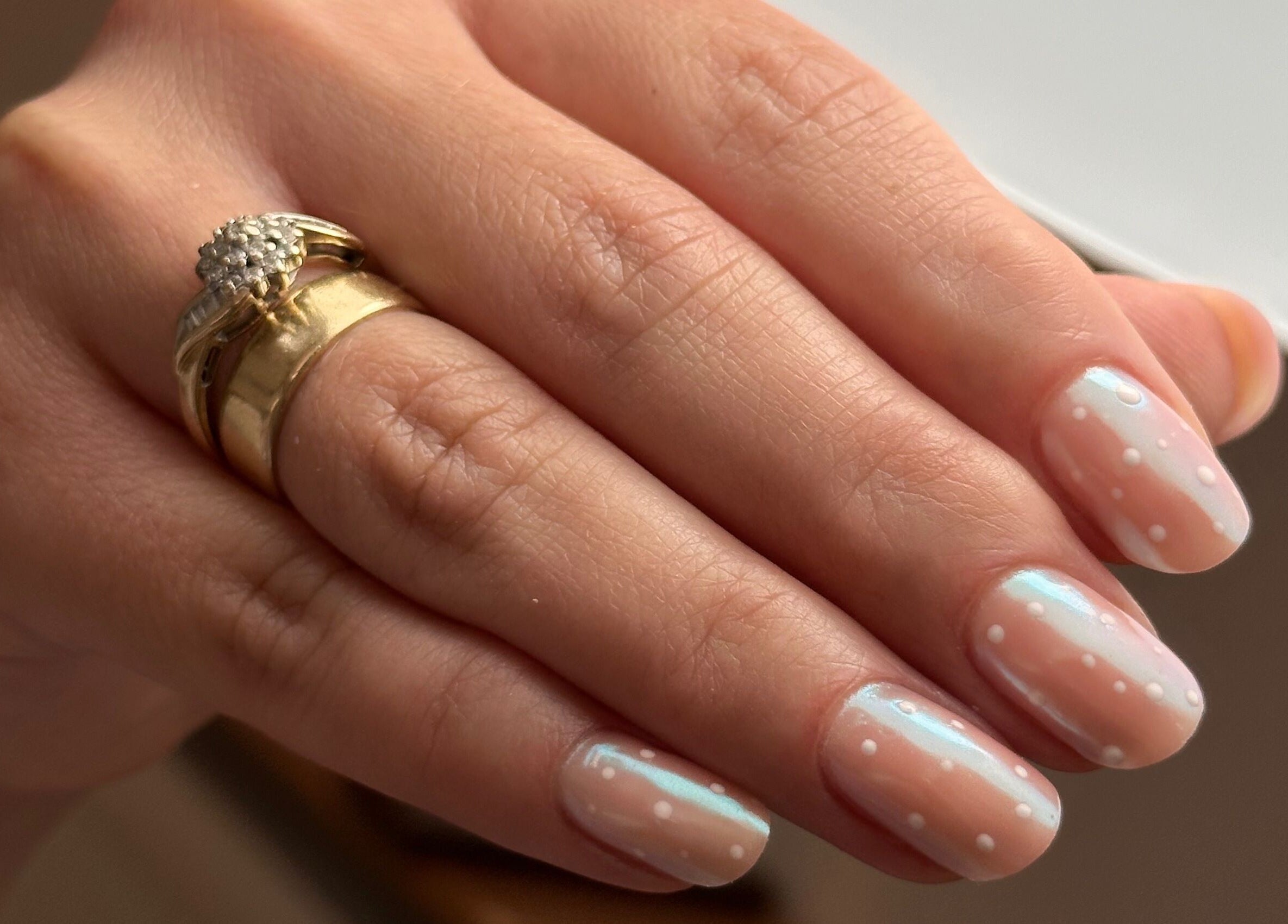 Stylish polka dot manicure at iloNails.tech in Worcester, England, GB. Perfectly polished nails with elegant design.