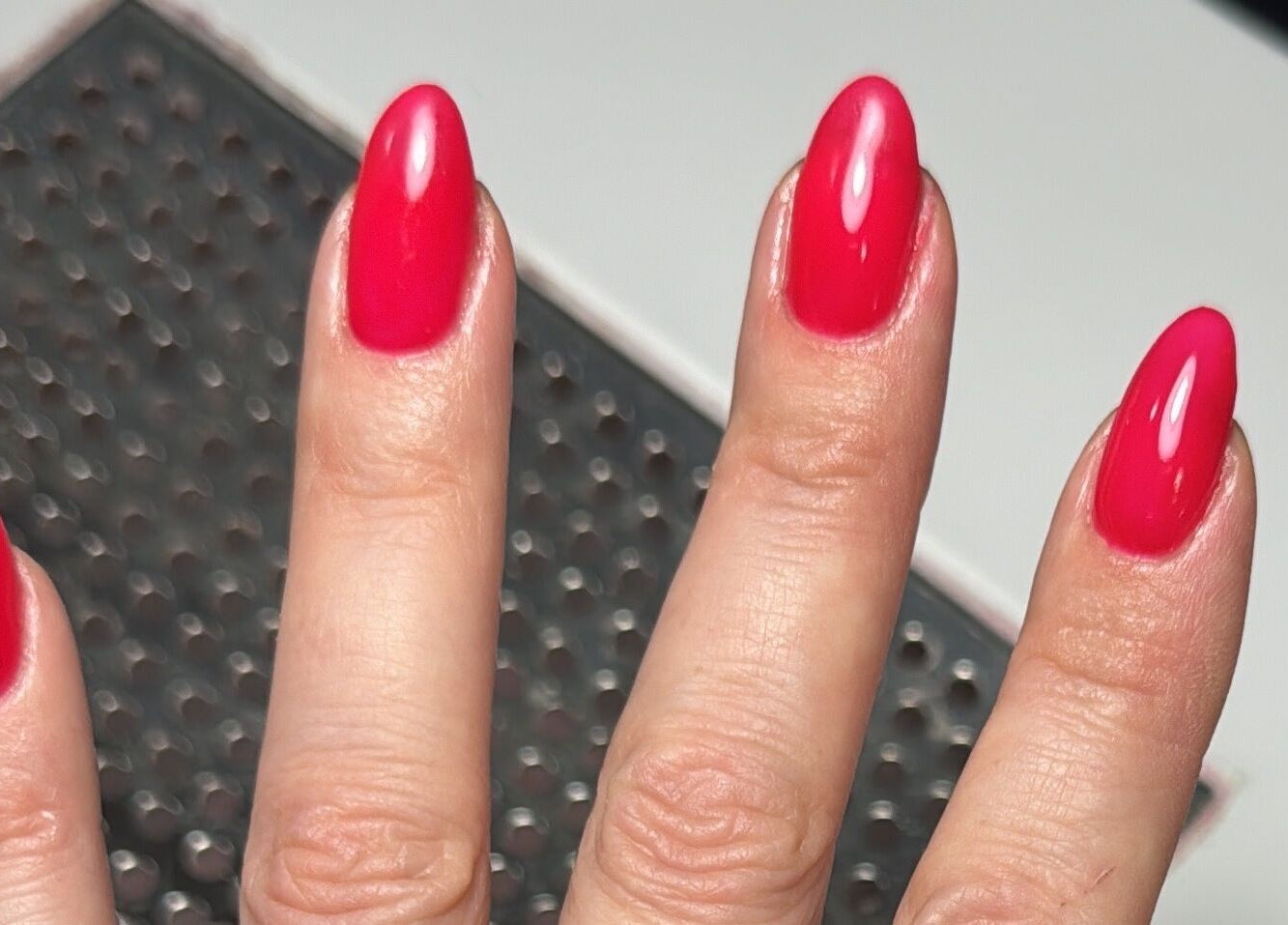 Glossy red manicure at The One Hand and Foot Spa, Roscommon, County Roscommon, IE. Perfect nail care service.