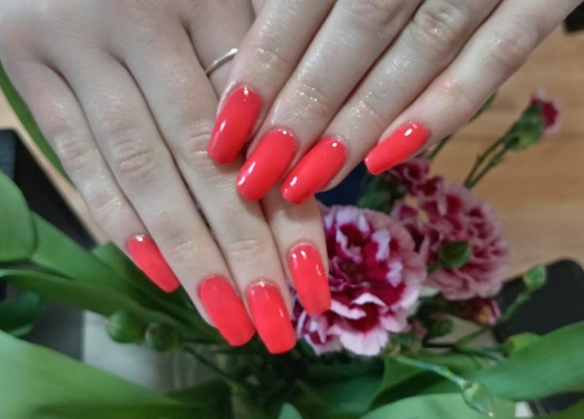 Bright red manicure at The One Hand and Foot Spa, Roscommon, County Roscommon, IE, showcasing nail elegance.