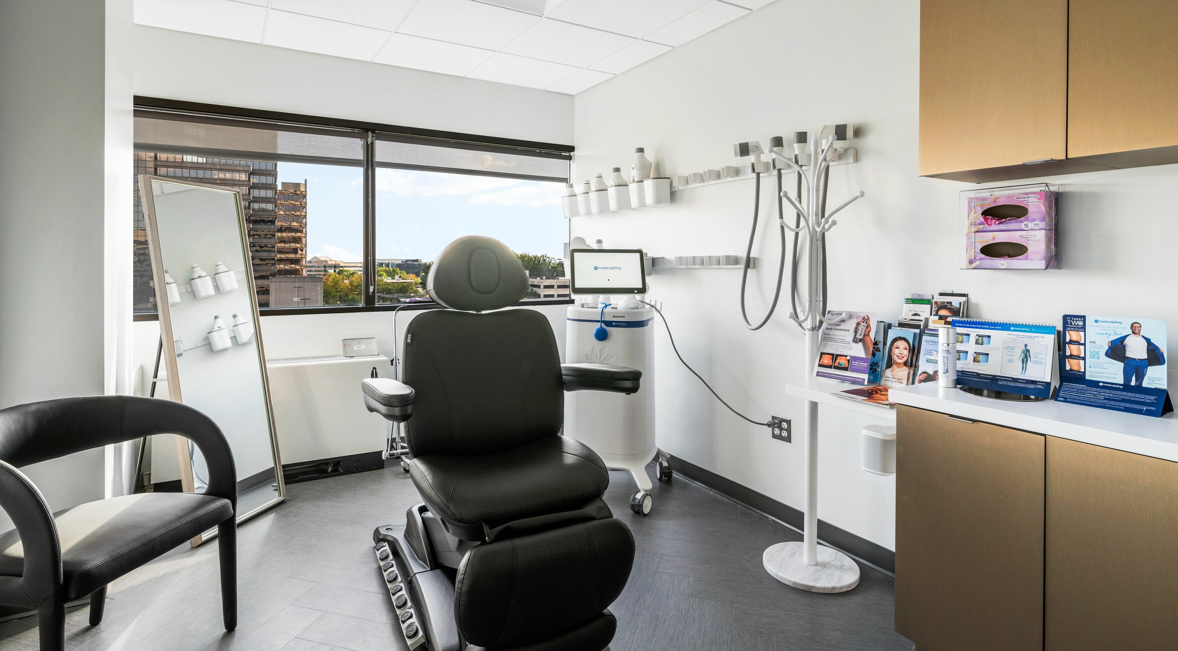 Modern treatment room at Luxe Dermatology and Aesthetic Center in Mclean, Virginia, US with elegant decor and equipment.