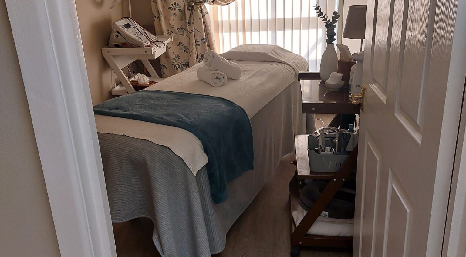 Tranquil treatment room at Select Beauty Salon, York, England, GB, showcasing a cozy massage table and calming decor.