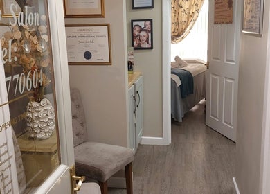 Entrance of Select Beauty Salon in York, England, GB showcasing certificates and decor.