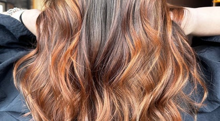 Elegant brown and copper wavy hair at Hair By Chrissie, Stoke-on-Trent, England, GB.