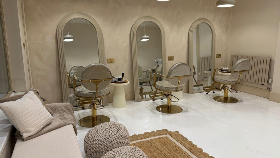 Luxurious beauty salon at Vanity, Stoke-on-Trent, England, GB with stylish mirrors and chairs.