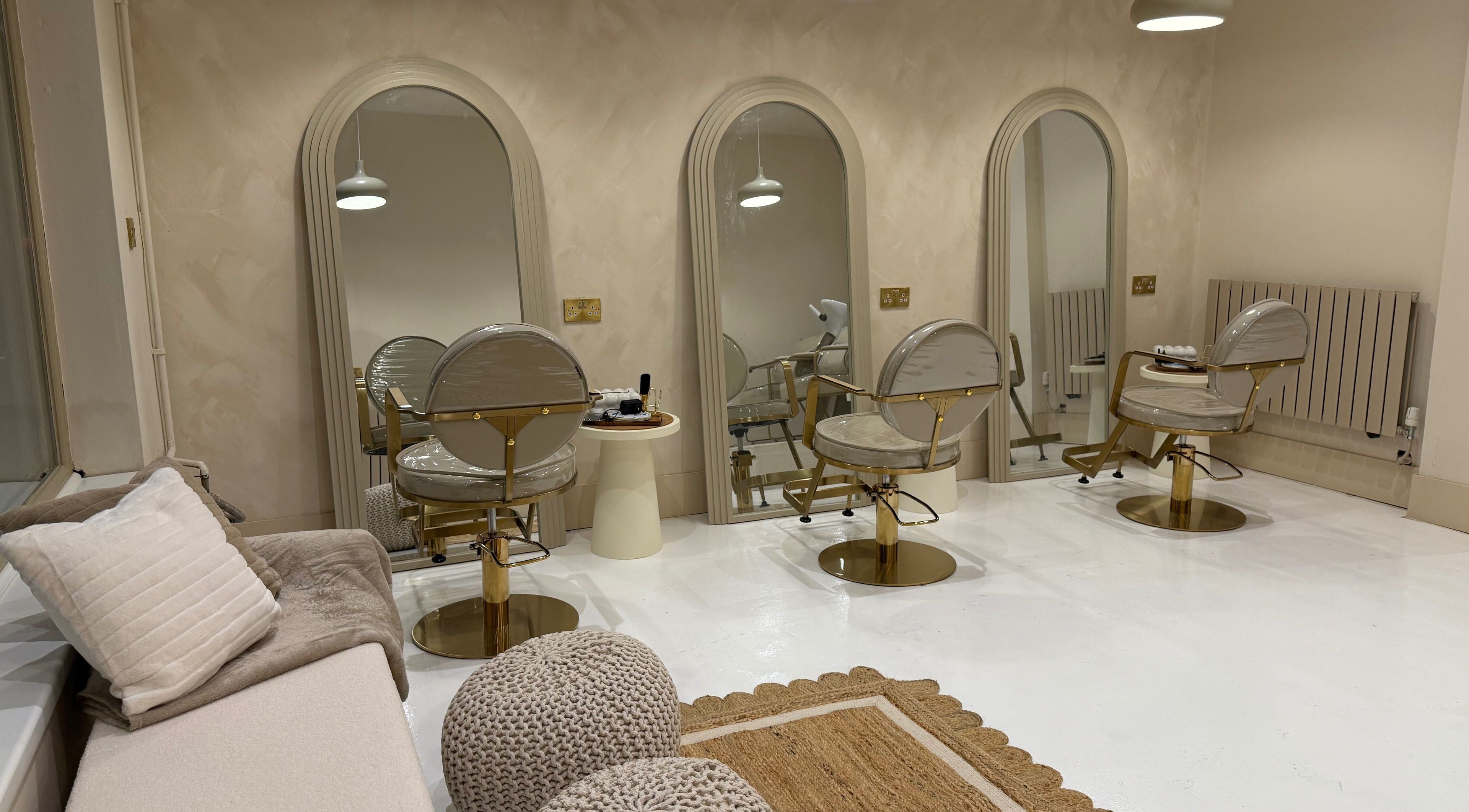 Luxurious beauty salon at Vanity, Stoke-on-Trent, England, GB with stylish mirrors and chairs.