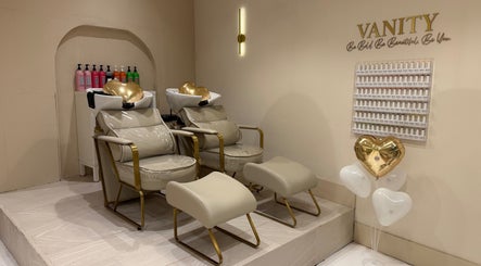 Luxurious beige salon chairs at Vanity in Stoke-on-Trent, England, GB, featuring heart-shaped balloons.