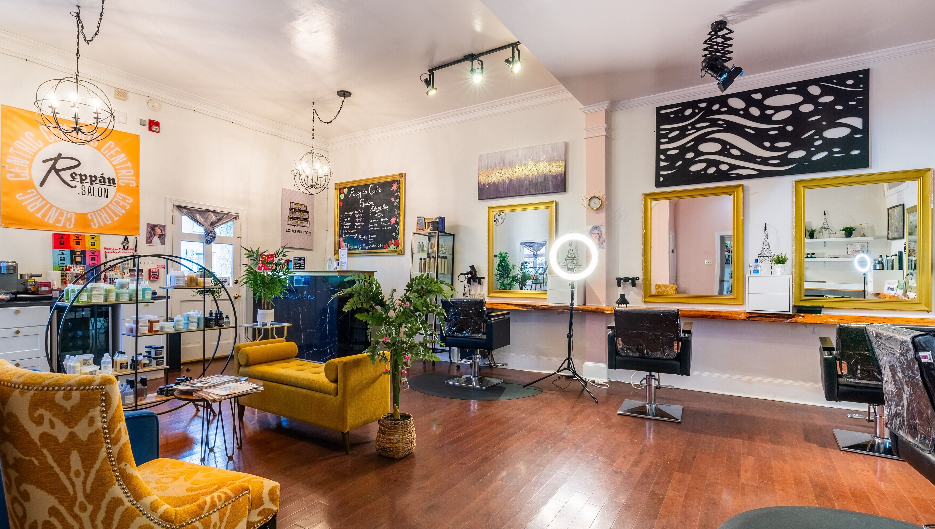Interior of Reppán Centric Salon in Philadelphia, Pennsylvania, US, featuring vibrant decor and stylish seating.